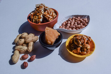 Singhdana chikki or Peanut brittles. Sankranti food winter special made of groundnuts and jaggery. Ingredients of mungphalli chikki