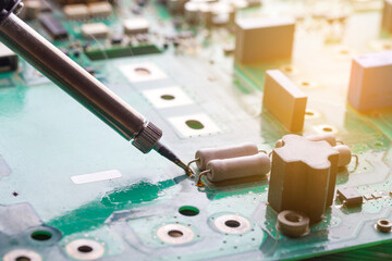 Soldering iron. Repairing electronic component