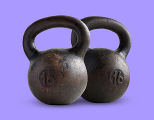 Fototapeta na wymiar two black iron weights of 16 kg isolated on violet background.