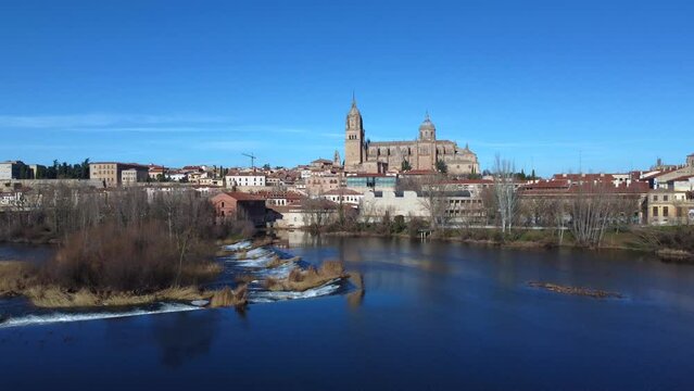 View of the Salamanca cathedral reflected in the Tormes river