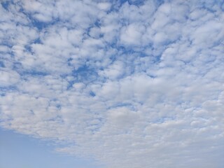 Picture of blue sky with white clouds in sky shot in the morning 