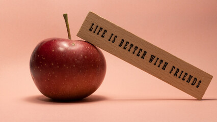 LIFE IS BETTER WITH FRIENDS was written on the wooden surface. Wooden Concept