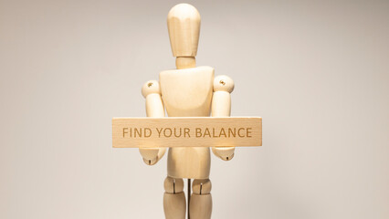 FIND YOUR BALANCE is written on the wooden surface. Wooden Concept