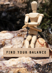 FIND YOUR BALANCE is written on the wooden surface. Wooden Concept