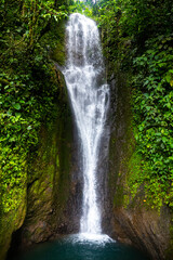 panorama of a hidden tropical waterfall in costa rica; waterfall in the rainforest; don jose waterfalls