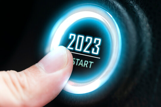 Finger press ignition button with the text 2023 start. business start-up concept.