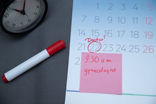 Reminder in the calendar about the appointment to the doctor, highlighted in red number in the calendar reminder of the visit to the medical office