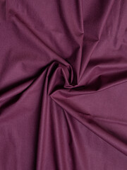 Maroon fabric texture background. Bed linen