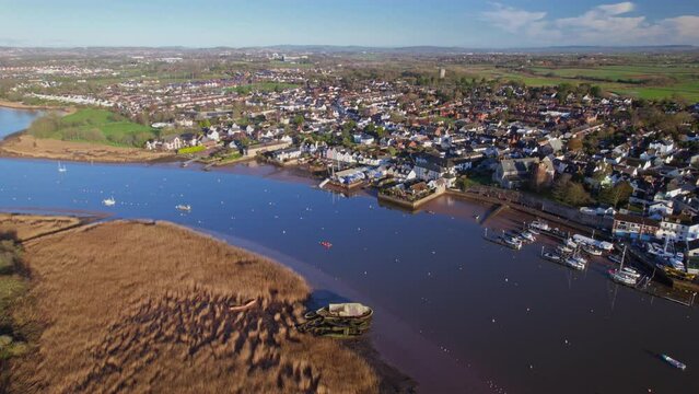 Aerial shot flying down towards Topsham Village and river Exe in Devon, UK