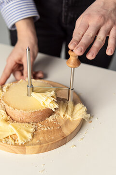 Shaving Tete De Moine Cheese Using Girolle Knife. Variety Of Swiss  Semi-hard Cheese Made From Unpasteurized Cows Milk, The Name Monks Head  Stock Photo, Picture and Royalty Free Image. Image 166728765.