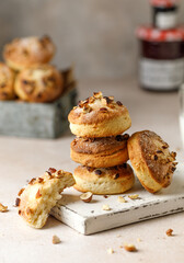 Yeast dough cookies with nuts. Homemade yeast cookies. Stack of tasty round cookies on pink background