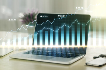 Double exposure of abstract creative financial diagram on modern laptop background, banking and...