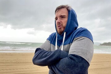Portrait of unhappy depressed frozen trembling guy, young shivering from cold sad upset man on the...