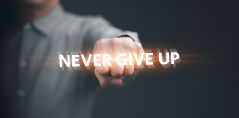 Close up of businessman fist bump hand. Male entrepreneur doing fist with encouragement message NEVER GIVE UP quotation