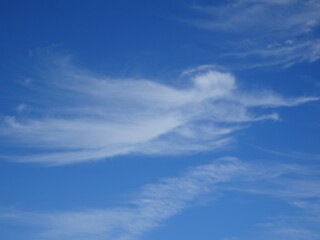 Naklejka na ściany i meble Blue sky with wispy clouds
