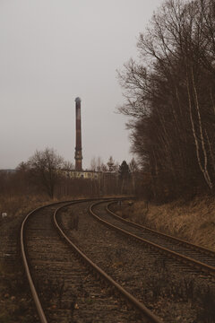 The curve of the double track chimney in the distance, the diffused light of a cloudy day. 