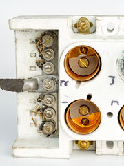 Old crusty ceramic fuse box closeup