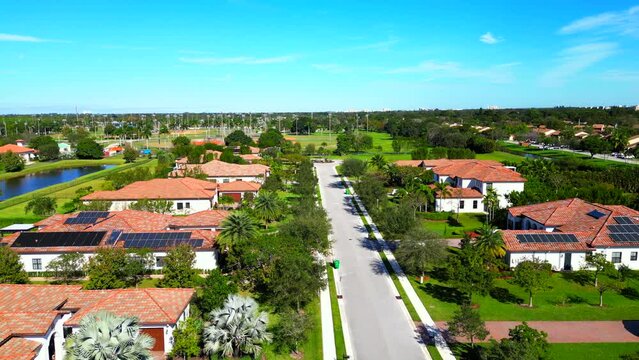 Aerial video luxury Florida homes with solar power roofs