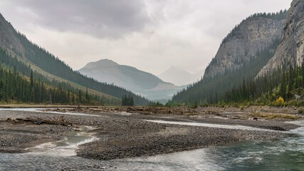A northern view of river and mountains from Weeping Wall of Saskatchewan River Crossing in Kananaskis Country (Claresholm), Alberta, Canada.