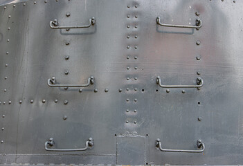 Steps of a ladder on the steel wall of a warship - obrazy, fototapety, plakaty