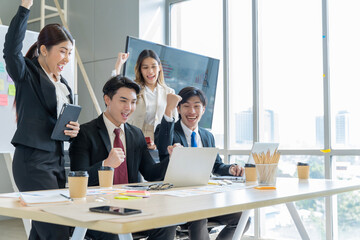 A group of young Asian businessmen Talking and planning work happily and have fun. at the company's office
