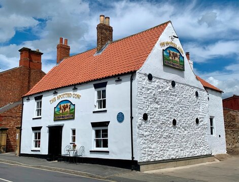 Malton, UK - June 26, 2022: The Spotted Cow pub in the village of Malton, Yorkshire, UK. 