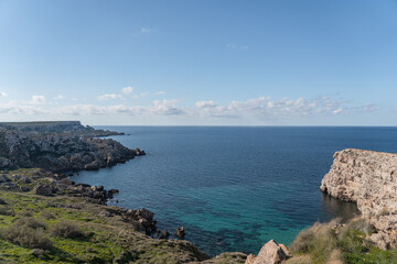 Fototapeta na wymiar The beautiful landscape in Malta with the sea, rocks and the cliffs. 