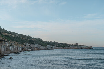 Fototapeta na wymiar Boat houses at Gnejna Bay in Malta.