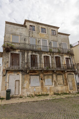 Fototapeta na wymiar Run-down, dilapidated building in Lisbon, Portugal