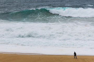 Photographer taking shots of big waves
