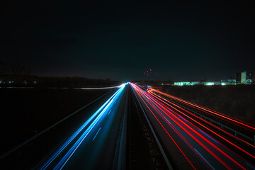 Fototapeta na wymiar Langzeitbelichtung - Autobahn - Strasse - Traffic - Travel - Background - Line - Ecology - Highway - Night Traffic - Light Trails - High quality photo 