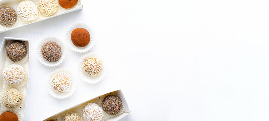 Assorted vegan sweets, Delicious Candy Balls with seeds, dried fruit and cocoa powder, Healthy Candies