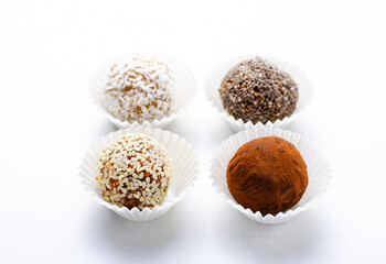 Assorted vegan sweets, Delicious Candy Balls with seeds, dried fruit and cocoa powder, Healthy Candies