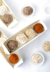 Assorted vegan sweets, Delicious Candy Balls with seeds, dried fruit and cocoa powder, Healthy Candies