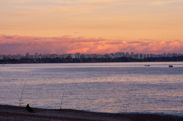 Beautiful sunrise landscape with Antalya city on seacoast.