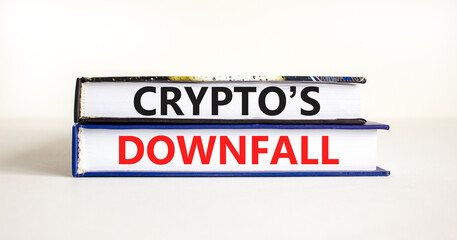 Crypto downfall symbol. Concept words Cryptos downfall on books. Beautiful white table white background. Business and crypto downfall concept. Copy space.