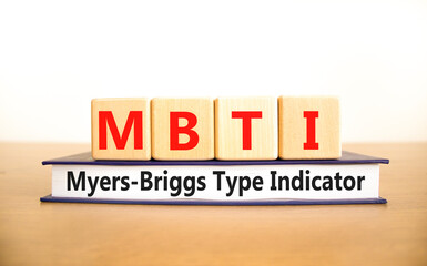MBTI Myers Briggs type indicator symbol. Concept words MBTI Myers Briggs type indicator on block on beautiful white background. Psychological MBTI Myers Briggs type indicator concept. Copy space