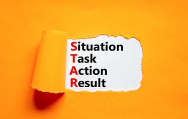 STAR situation task action result symbol. Concept words STAR situation task action result on white paper on beautiful orange background. Business STAR situation task action result concept. Copy space