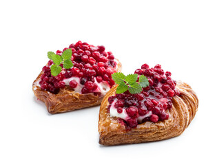 Flaky pastry with cream and cowberry isolated on white
