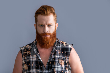 brutal bearded man in studio, copy space. brutal masculine man on background.