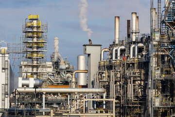 Industrial facility at a refinery with smokestacks for fuel production