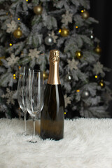 Christmas composition with glasses a bottle of champagne