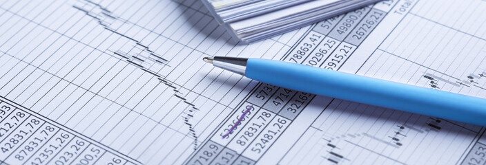 Accounting document with pen, share listing and checking financial chart. Concept of banking, financial report and financial audit.