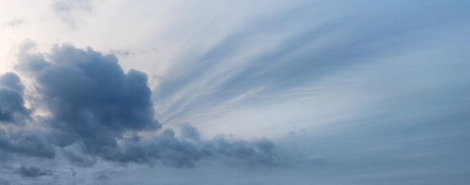 Overcast sky with a big dark curly cloud © Volodymyr