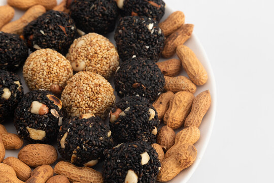 Indian Winter Delicacy Black Ball Shaped Kaala Tilgul Laddu Or Kale Til Ki Laddo Is Made Of Roasted Sesame Seed, Jaggery, Gur, Peanut, Gud, Mungfali Is Enjoyed In Winter On Makar Sankranti and Lohri