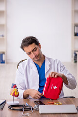 Young male doctor paramedic working in the clinic