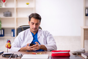 Young male doctor in telemedicine concept