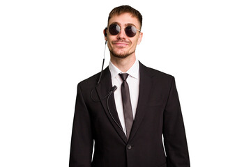 Security bodyguard man wearing a suit isolated cut out dreaming of achieving goals and purposes