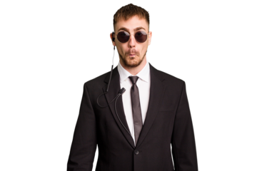 Security bodyguard man wearing a suit isolated cut out shrugs shoulders and open eyes confused.