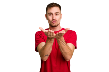 Young caucasian man cut out isolated folding lips and holding palms to send air kiss.